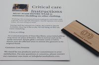 Care instructions sheet for clothing with a wooden brush on a white background